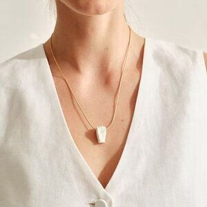 Andres Gallardo fist pendant necklace